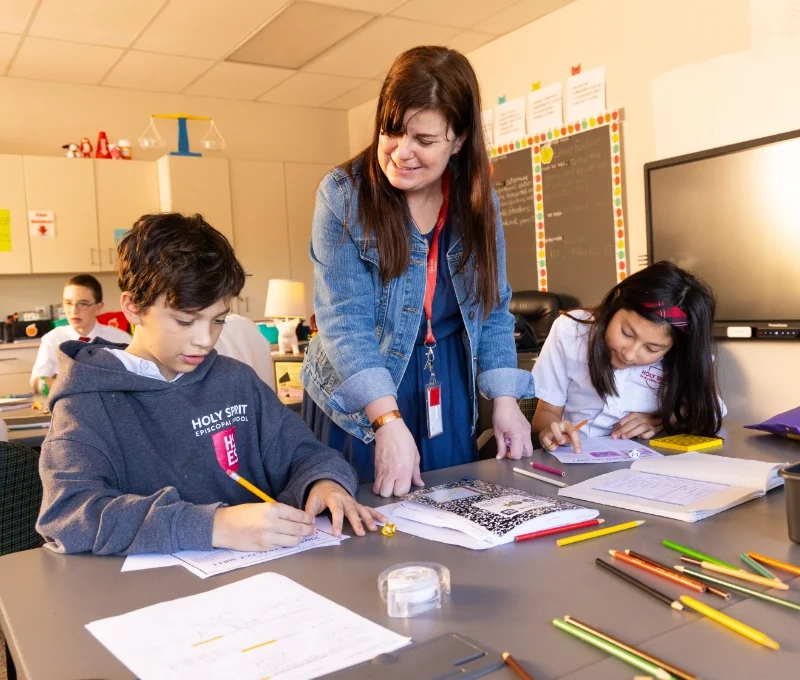 teacher working with 2 students