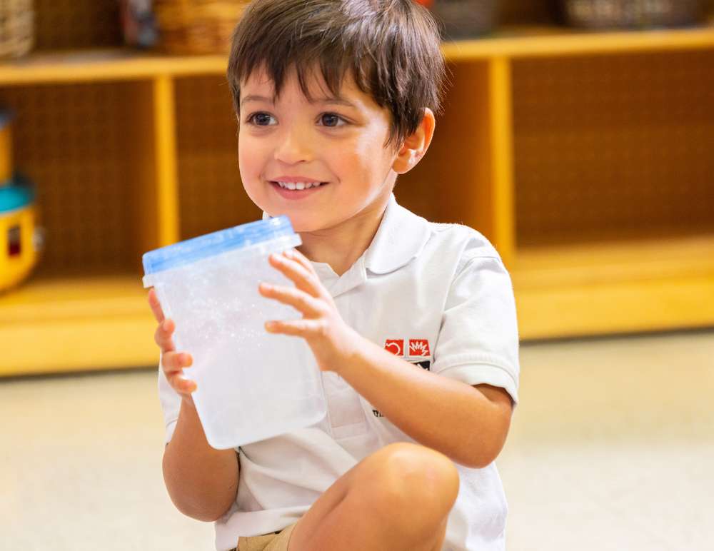 Smiling student engaged in the classroom activity