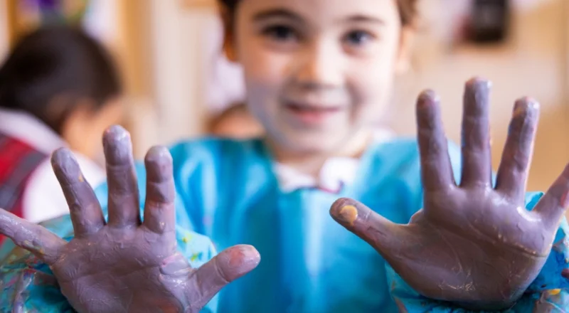 student with painted hands