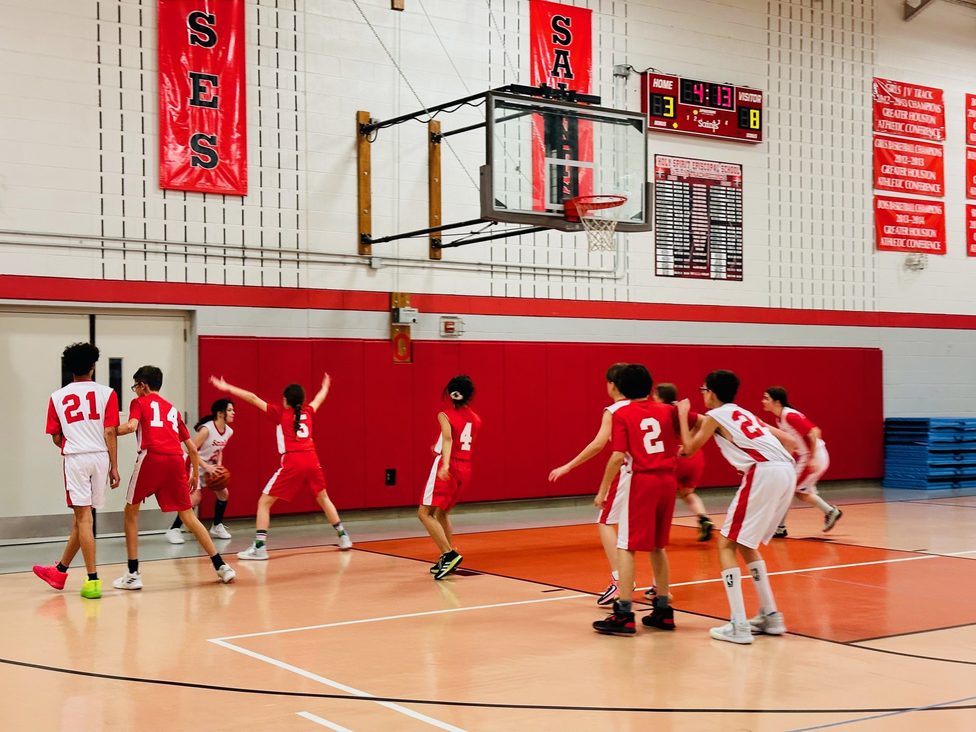 Action shot of students playing basketball