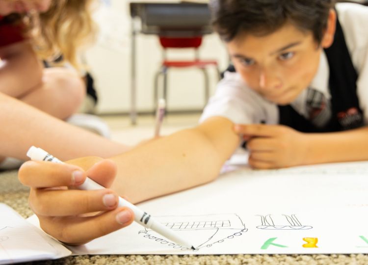 HSES student drawing with markers